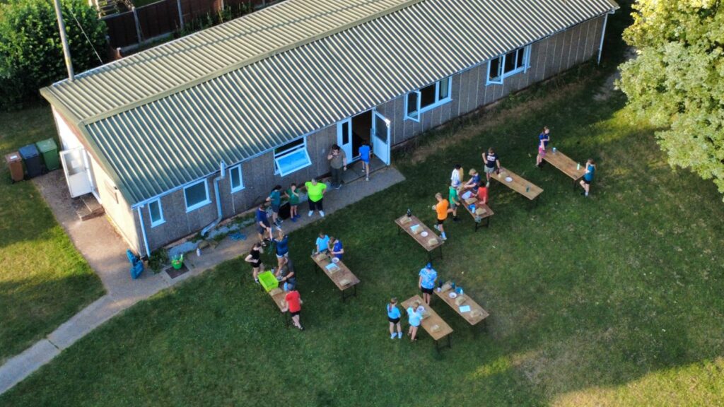 Scouts making bird houses and playing water games